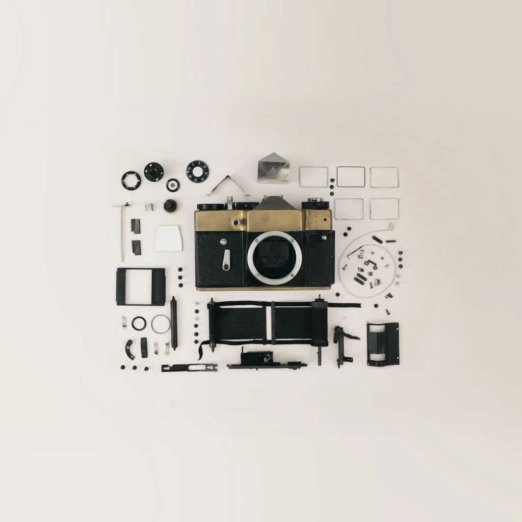 Disassembled smartwatch with exposed heart-rate sensor array on an anti-static mat.